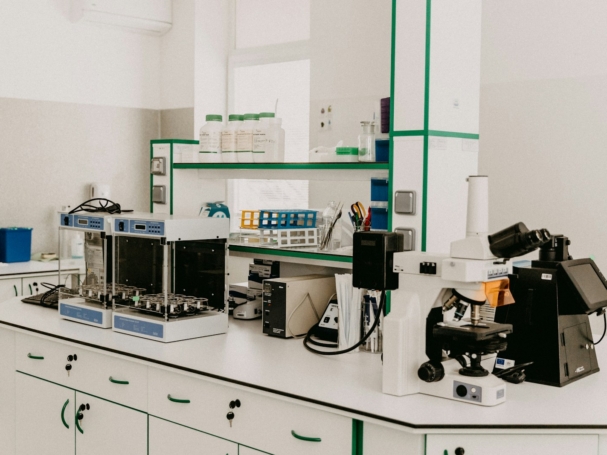 black and silver coffee maker on white wooden table