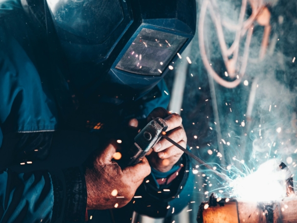 man using welding machine